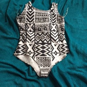 One piece black and white swim suit.